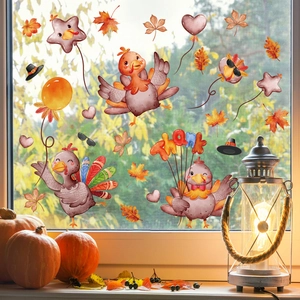 Thanksgiving window clings set with cartoon turkeys and maple leaves on a glass window