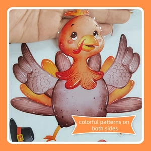 Detail of double-sided turkey window sticker showing colorful patterns on both sides