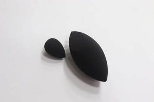 Close-up of black makeup sponge set with olive cut and mini sizes for dual-use