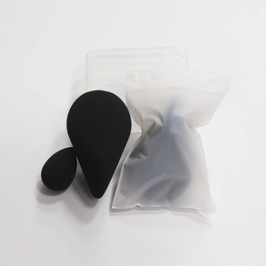 Detailed set of black makeup sponges in sizes with clear case and packaging