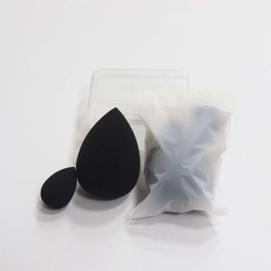 Detail of black beauty blender set with drop-shaped sponges and clear storage box