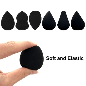 Detail of soft black makeup sponges showing high elasticity and various geometric shapes