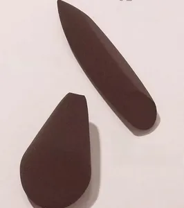 Detailed view of dark brown makeup sponges showing high-density flocking texture for makeup