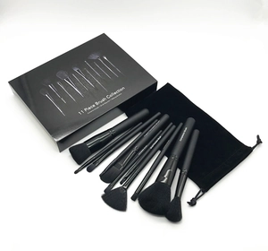 Macro detail of professional 11pcs black makeup brush set with storage bag and box