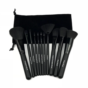 12-piece professional black makeup brush set with storage pouch on white background