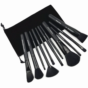 11-piece professional black makeup brush set with wooden handles and velvet pouch