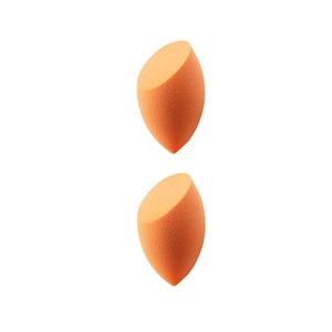 Macro shot of two orange slanted beauty sponges made of high-density non-latex material