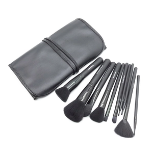 Professional 10-piece makeup brush set with black wooden handles and portable leather roll pouch