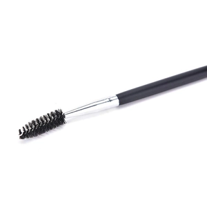 Dual-headed eyebrow brush No. 12 with black spiral fibers and silver ferrule on white background