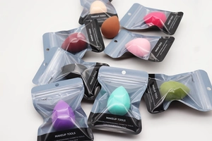 Detailed view of colorful teardrop makeup sponges in frosted individual zip-lock bags