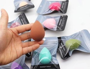 Macro view of teardrop makeup sponges in multi-color options with independent bag packaging