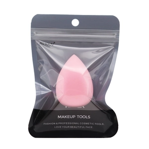 Detailed view of pink teardrop makeup sponge in a transparent branded resealable pouch