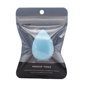 Detail of light blue hydrophilic makeup sponge in a translucent frosted zip-lock bag