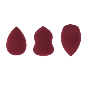 Three burgundy makeup sponges in drop, gourd, and flat-cut shapes on a white background