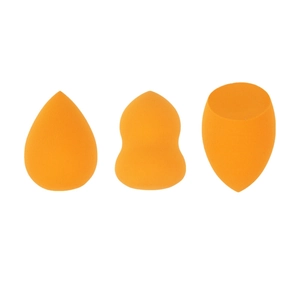 Detailed view of three orange non-latex makeup sponges in teardrop, gourd, and bevel shapes