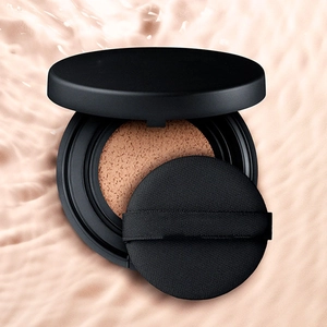 Black non-latex air cushion puff with foundation sponge set on a ripple background
