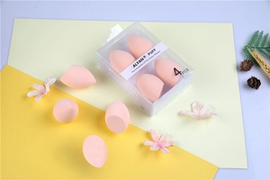 Detail of 4-piece pink makeup sponge set in transparent box with olive cut design
