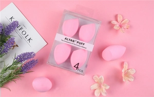 Detailed view of pink makeup sponges set with teardrop and slant-cut shapes in a box