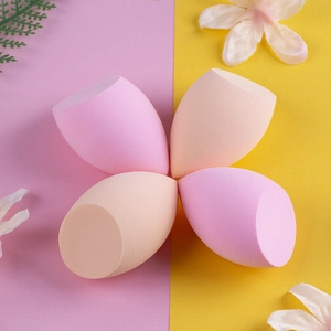 Close-up of 4-piece olive cut makeup sponge set in soft pink and beige tones