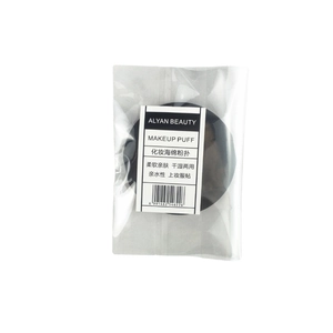 Premium black non-latex cosmetic puff in transparent packaging with brand card