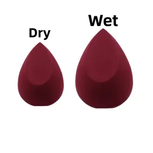 Teardrop makeup sponge comparison showing dry size vs wet expanded size in burgundy red