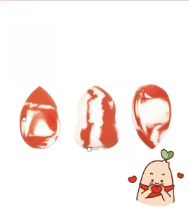 Close-up of marble pattern makeup sponges in teardrop, flat-cut, and gourd shapes