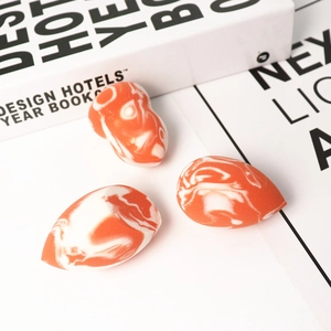 Orange marble makeup sponge set with teardrop and gourd shapes for seamless blending