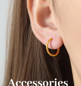 Close-up of elegant 18k gold plated large hoop earrings worn on a female model