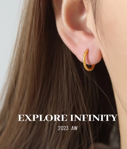 Close-up of minimalist 18K gold-plated chunky hoop earrings with polished finish