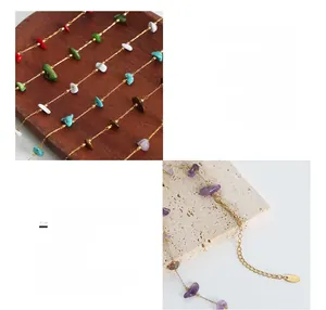 Detail of multi-color natural stone charms on 18K gold plated titanium steel necklace