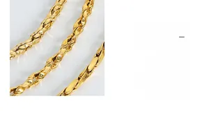 Close-up detail of golden braided chain link with a wavy texture and polished metal finish