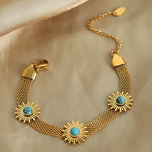 Retro 18K gold plated titanium bracelet with turquoise sunflower charms on silk