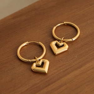 Gold-plated heart-shaped open hoop earrings featuring a minimalist geometric design