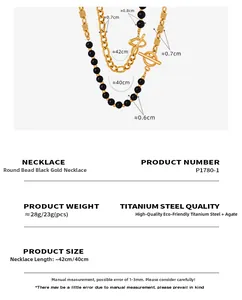 Macro detail of OT buckle black agate beaded necklace in 18k gold-plated stainless steel