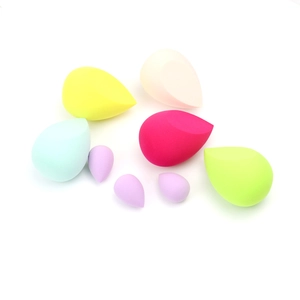 Set of 8 colorful teardrop makeup sponges in various sizes for wet and dry cosmetic use