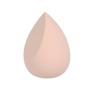 Close-up of pink teardrop beauty blender with slanted edge on white background