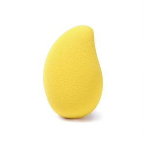 Macro shot of mango shaped yellow makeup sponge with fine pores for smooth application