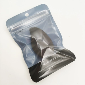 Detail of professional black makeup sponge inside its sealed blue and black brand packaging
