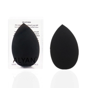 Detail of two black teardrop makeup sponges with transparent storage box packaging