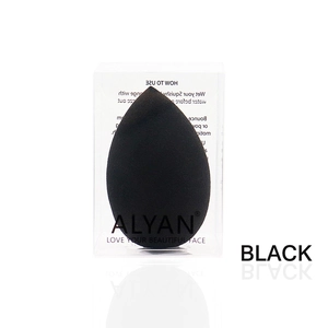 Detail of soft black teardrop makeup sponge in clear plastic case from ALYAN