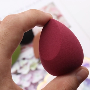 Burgundy teardrop cut makeup sponge puff made of hydrophilic non-latex material
