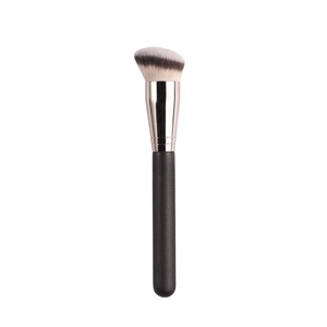 Angled foundation makeup brush with synthetic bristles and black handle on white background