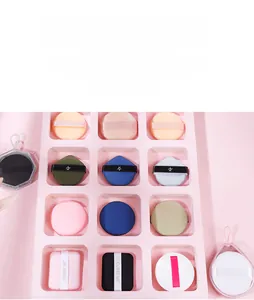 Detailed view of various colorful makeup puffs in round square and teardrop shapes
