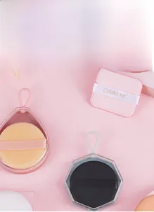 Close-up of assorted non-latex cushion puffs with transparent storage cases for makeup