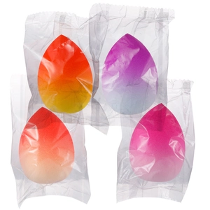 Set of four gradient colorful teardrop makeup sponges in individual plastic packaging