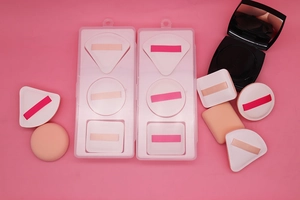 Detail view of multi-shaped Rubycell marshmallow makeup puffs with storage cases