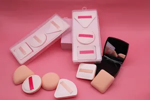 Detail view of various makeup sponges in round and square shapes with clear storage cases