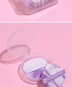 Close-up of marble texture makeup sponge with purple ribbon and clear storage box
