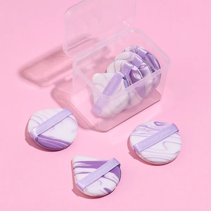 Purple marble makeup sponge set with round and teardrop puffs in a clear storage box