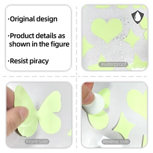 Detailed view of waterproof luminous green butterfly and heart stickers for bathroom decor